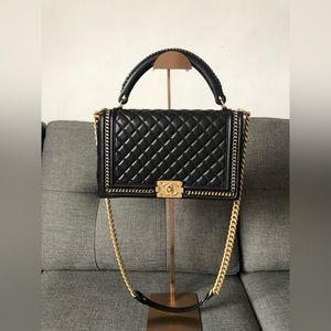 Limited edition Chanel boy handle black and gold